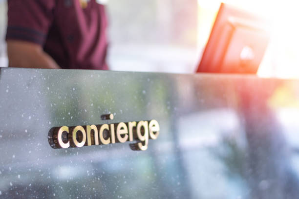 istockphoto-1146354837-612×612 Concierge service desk counter with staff team working in front of hotel with tourist business customer.